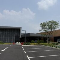 Completed Hillcrest Sales Gallery in Puchong, showing the building exterior and parking area