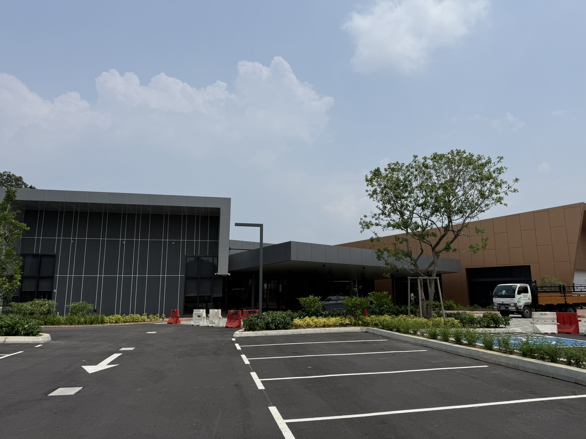 Completed Hillcrest Sales Gallery in Puchong, showing the building exterior and parking area